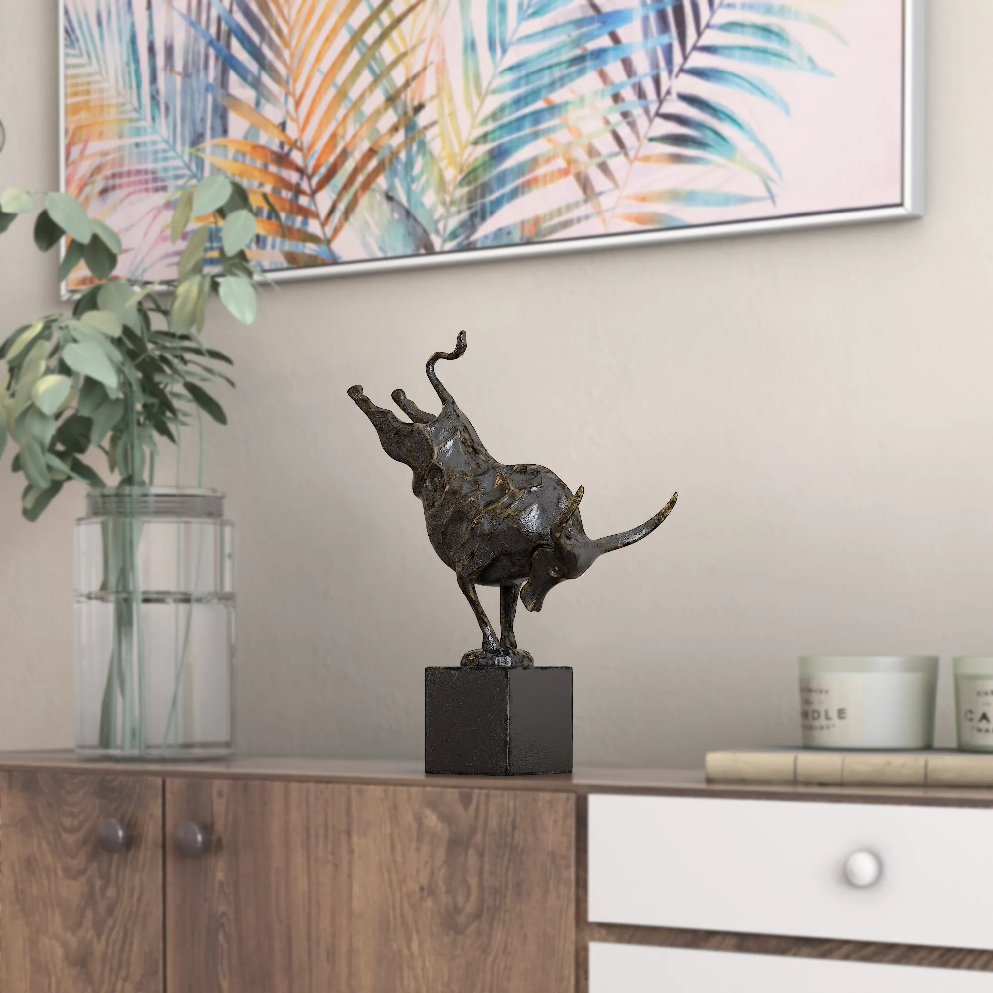 Bull performing handstand sculpture